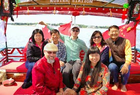 Monte Gisborne, front left and his wife, Luo Dan Ni (Daniela), pose with a group of Chinese tourists who took a ride last year aboard the couple’s Chinese junk boat that sails from Peakes Quay Marina in Charlottetown. China is a growing tourism market for Canada.