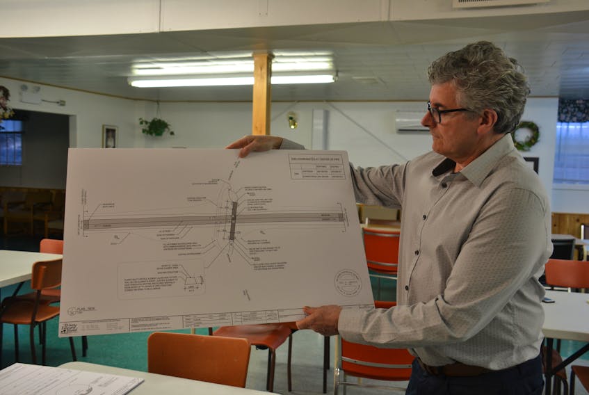 Provincial bridge engineer Neil Lawless shows the plans for the replacement of the McCannel bridge at the Fort Augustus Recreation Centre April 19. Bridge construction is set to begin May 14.