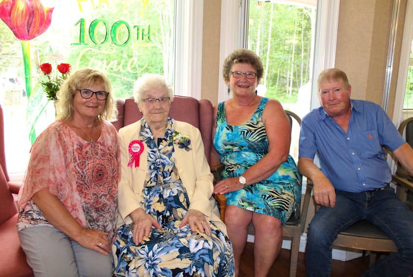 Annie Leard, second left, celebrates her centennial birthday at the South Shore Villa on Aug. 19 with her friends and family. She is shown with her children, from left, Margaret Gaudet, Sharon Rose and Donald Leard.