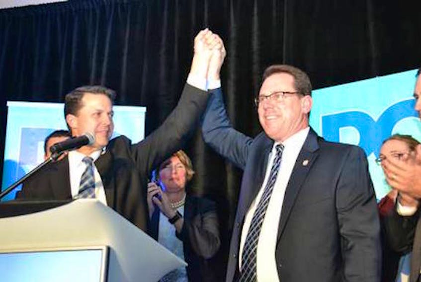 James Aylward, right, is congratulated by Brad Trivers after winning the leadership of the Progressive Conservative Party of P.E.I. in Brudenell last Friday night.
(Guardian photo)