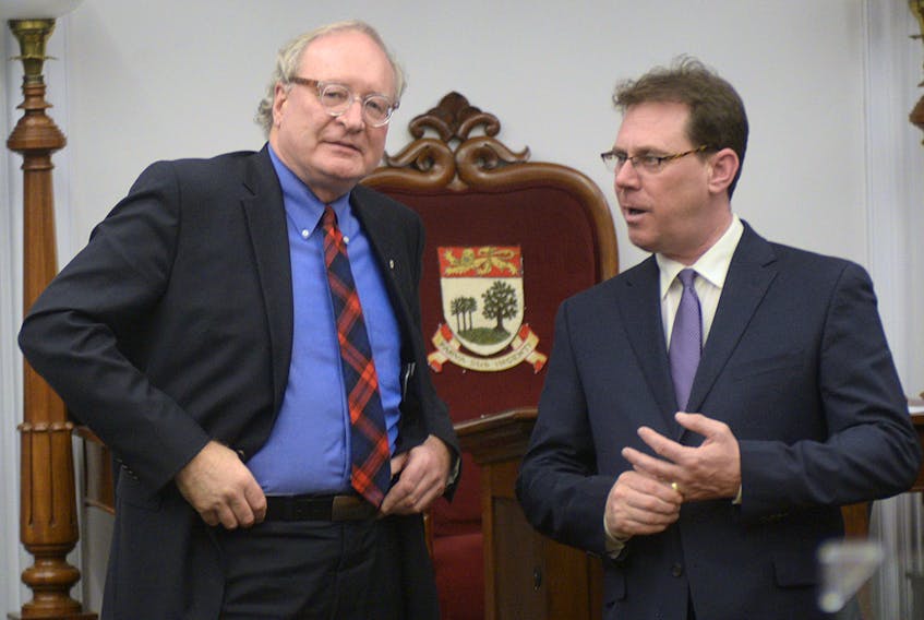 P.E.I. Premier Wade MacLauchlan, left, and PC leader James Aylward speak in the legislature after the fall session wrapped up Wednesday, Dec. 20, 2017.