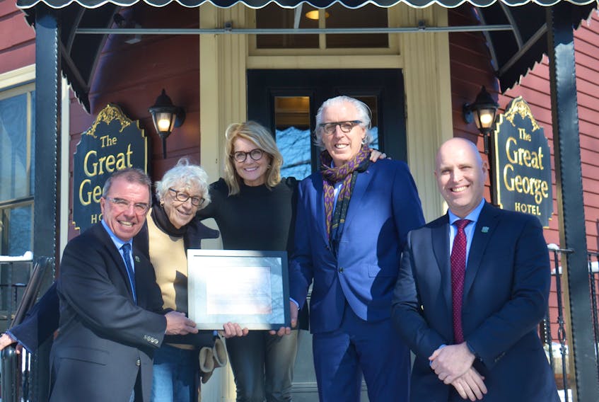 Kevin and Kathy Murphy are the recipients of the Catherine G. Hennessey Award for 2019. Shown with them outside their Charlottetown hotel, The Great George, are Mayor Philip Brown, left, award-namesake Catherine Hennessey and Coun. Greg Rivard. The annual award recognizes a group or individual who has fostered the city’s heritage. Mitsuki Mori/The Guardian