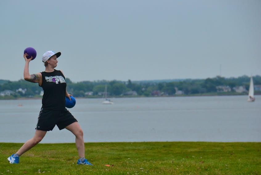 Leanne Wilson, president of Dodgeball P.E.I., winds up for the toss during the Pride Week field day in Victoria Park on Sunday. While there was a little rain in the afternoon, it didn’t stop a handful of people from making the best of it.
