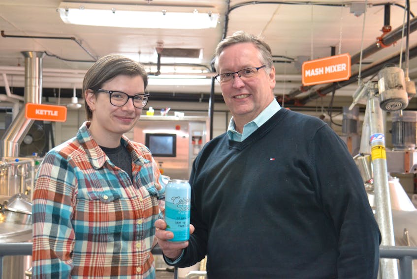 Kate Publicover, a quality control technician at the P.E.I. Brewing Company joins company vice-president Bob Lawrence as they show off their latest creation, a new gin-based cocktail, Colliding Tides, which hits the shelves at all P.E.I. liquor stores April 1.