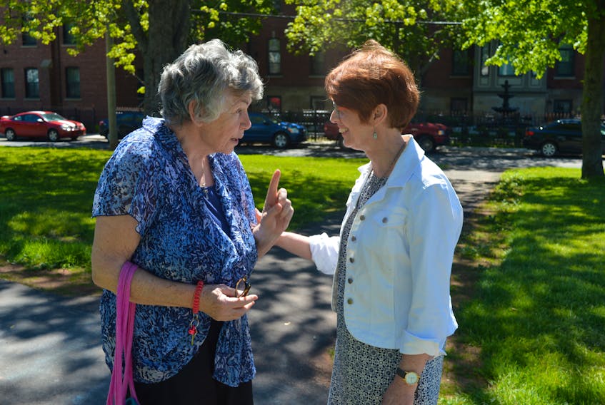 Kim Devine, right, talks with Charlottetown resident Joan Cummings on Friday after declaring her intention to seek the mayor’s chair in the Nov. 5 municipal election. Devine served on council from 2004 to 2010.
