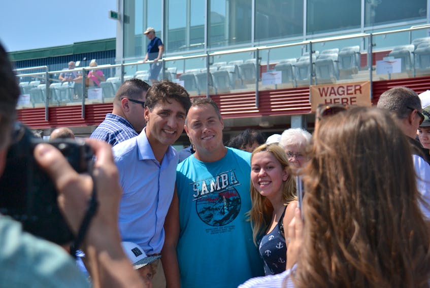 Justin Trudeau poses for a photo during a visit to the Red Shores Race Track last Summer. A new poll shows Trudeau's Liberals continue to be the most popular political party on P.E.I.
Stu Neatby/THE GUARDIAN