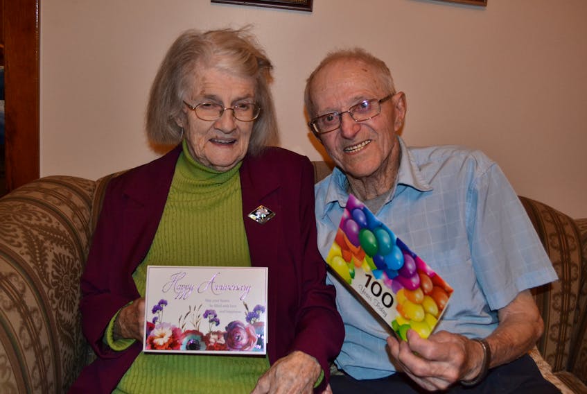 Jean and Ted Hudson sort through some of the anniversary and birthday cards they’ve received. The Cascumpec couple was married 72 years ago on Sept. 18 while Ted turned 100 on Sept. 21.
