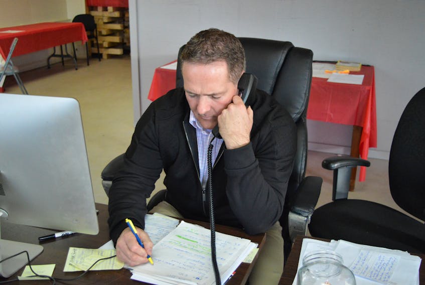 District 11 Liberal candidate Bob Doiron works the phones Wednesday at his campaign headquarters ahead of Monday’s byelection. (Dave Stewart/The Guardian)