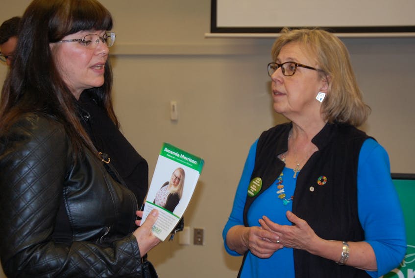 Brenda Powell, left, president of the National Association of Federal Retirees, an advocacy group that promotes the interests of retired federal employees, discusses issues with Elizabeth May, leader of the Green Party of Canada. May was in Prince Edward Island Monday and Tuesday helping to drum up support for the Green Party of P.E.I. heading into Tuesday’s provincial election.