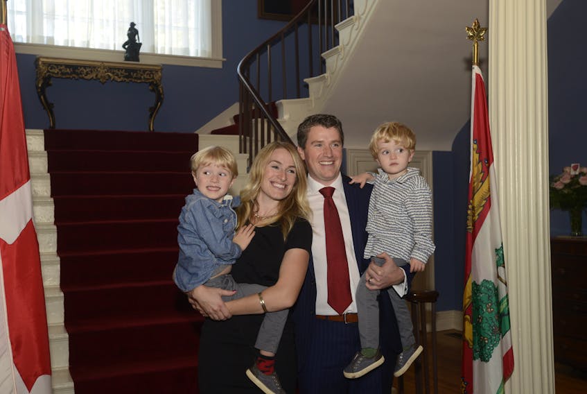 Education Minister Jordan Brown poses with his wife Amy Boswell and sons Finlay, 4, and Aulay, 2, after the cabinet swearing-in ceremony at Government House on Monday. Brown replaces Doug Currie, who resigned from public office last week. (Teresa Wright/ The Guardian)