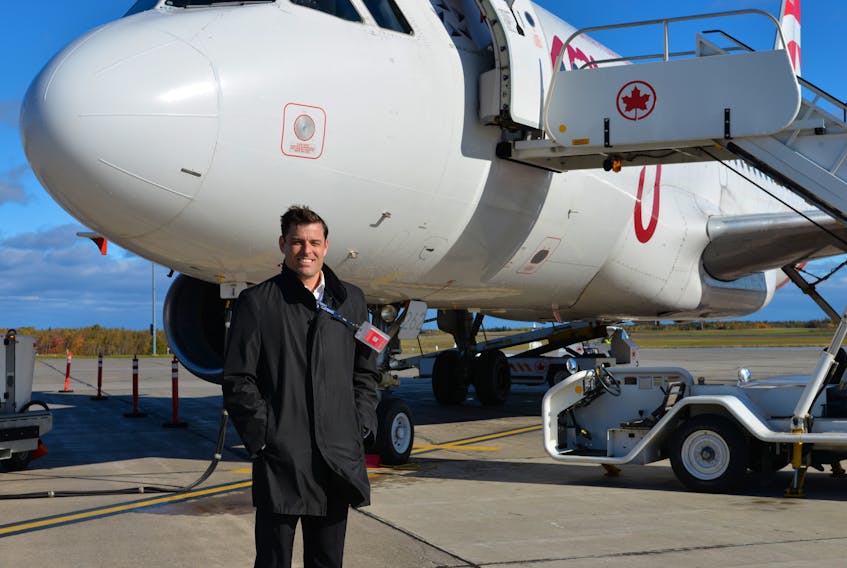 Doug Newson, CEO of the Charlottetown Airport Authority, stands in front of the airplane that arrived from Toronto and was the first to land on the newly opened, renovated main runway on Oct. 22, 2018. Work on the main runway began six months ago at a cost of $18 million. Zhishun Xu/The Guardian