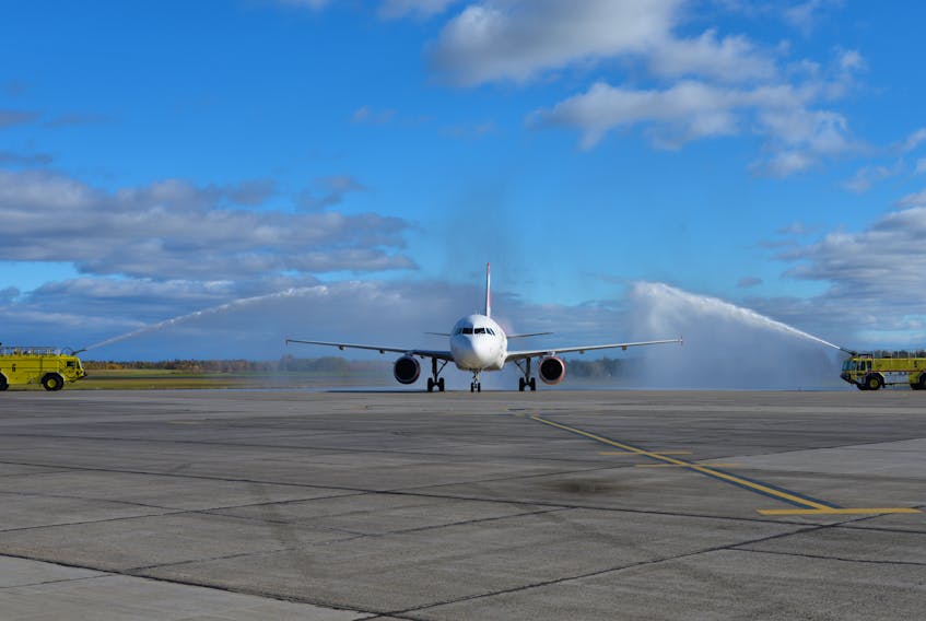 This Air Canada Rouge plane that was the first to land on the rehabilitated main runway Monday received a water salute from two fire trucks at the Charlottetown Airport on Oct. 22, 2018.