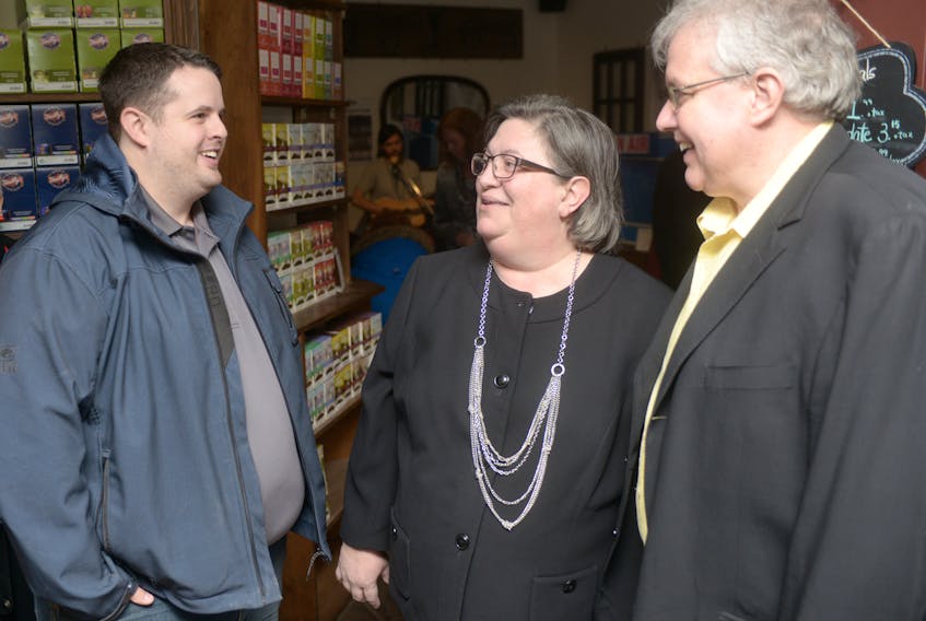 NDP P.E.I. leadership hopefuls, from right, Joe Byrne and Margaret Andrade, chat with party member Matt Cochrane during a meet and greet at Charlottetown's Timothy's World Coffee on Saturday. The event gave party members a chance to meet and converse with the two candidates before a leadership convention scheduled for Saturday, April 7.