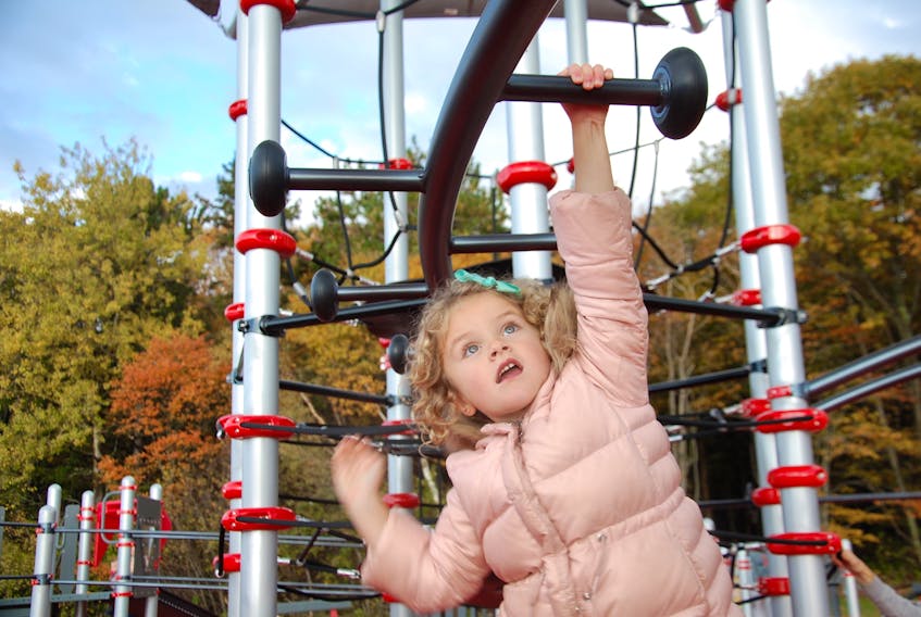 Five-year-old Annie McGonnell of Charlottetown swings on the monkey bars at the new Canadian Tire Jumpstart Playground at Victoria Park in the capital city. The accessible 9,000-square-foot playground features double wide ramps, a roller slide, bucket seat harness swings, bridges, interactive educational panels, spinners, musical instruments and a calming zone.
