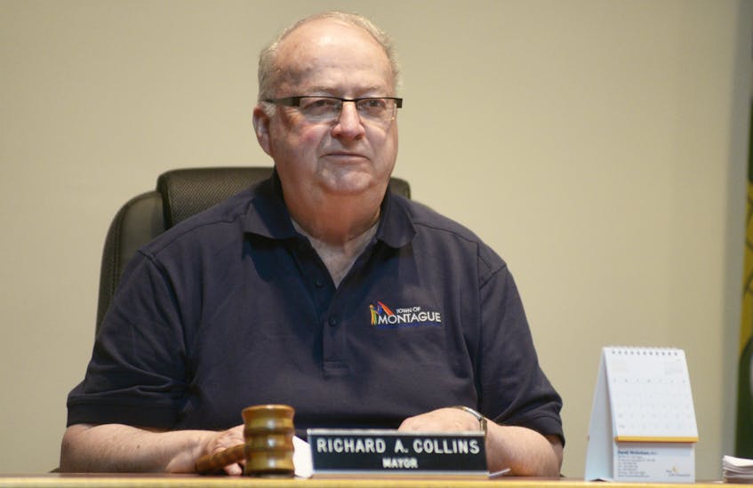 Montague Mayor Richard Collins listens to a presentation during Monday’s committee of council meeting. Council is currently preparing to fight against the Three Rivers proposal, which is about to start mediation.