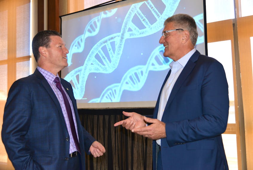 Martin Yuill, left, director of Emergence Bioscience Business Incubator in Charlottetown, talks with Ken Rotondo, president and founding partner of the U.S. company Mind Geonomics Advisors, at the launch of Global Biotech Week (Sept. 24-30) on Monday at the Delta Prince Edward.
