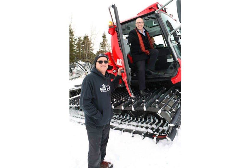 Economic Development and Tourism Minister Chris Palmer, right, and operations manager Allan Matters check out the new groomer at Mark Arendz Provincial Ski Park at Brookvale. The old groomer at Brookvale had been in service for over 20 years, and a breakdown in December caused a delay to the start of the season over the Christmas holidays. The province invested $397,000 to purchase the new Pistin-Bully groomer.