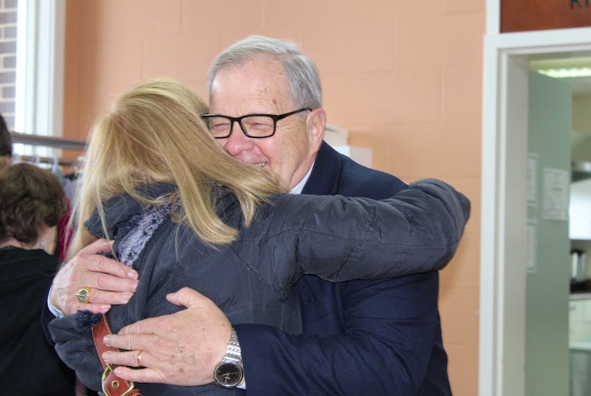 A supporter congratulates Cardigan MP Lawrence MacAulay on his 30 years serving as the MP for Cardigan during a celebration at St. Peters Bay Complex Sunday. The now 72-year-old MacAulay was first elected as an MP on Nov. 21, 1988.