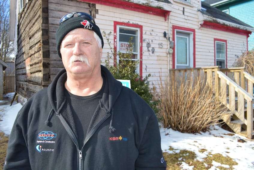 Ray Campbell had originally intended to fix up this old log home at 15 Hillsborough St. in Charlottetown but has ended up selling it due to the cost of renovation and running into problems with the city.