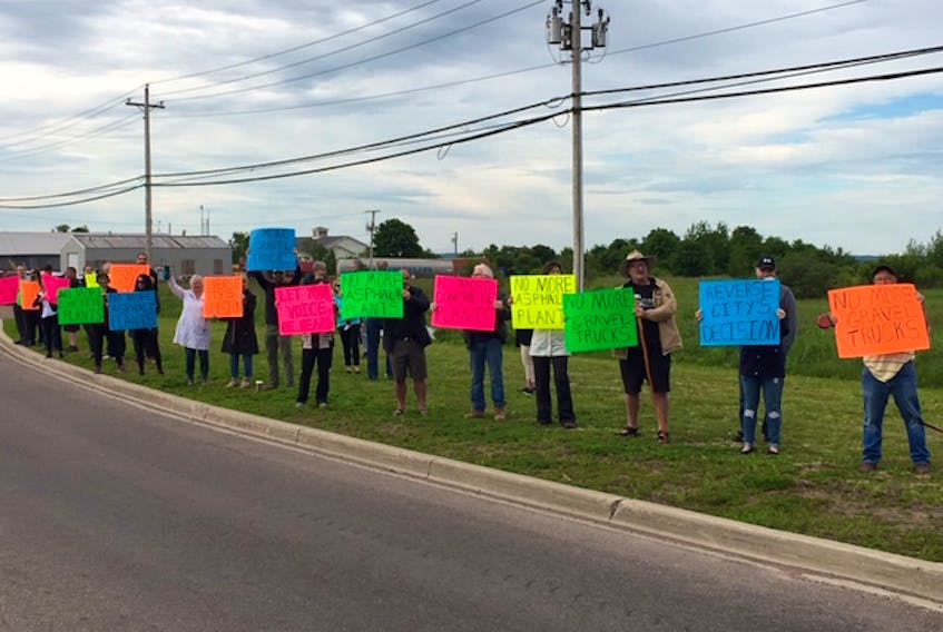 Protestors on Sherwood Road oppose a proposed asphalt plant June 26.