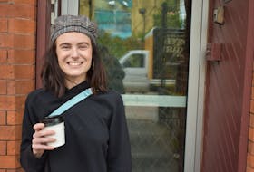 Emily Acorn enjoys a coffee in downtown Charlottetown after voicing her concerns on housing.