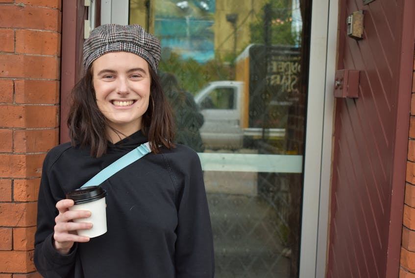 Emily Acorn enjoys a coffee in downtown Charlottetown after voicing her concerns on housing.