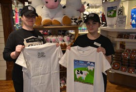 Nicole Lewis and Lauren Bridges, employees at Cows on Queen Street in Charlottetown, show off the limited edition T-shirt designed to raise funds for the Canadian Mental Health Association, P.E.I. division, in honour of Jason Driscoll, an Island man who lost his battle with mental health last spring.