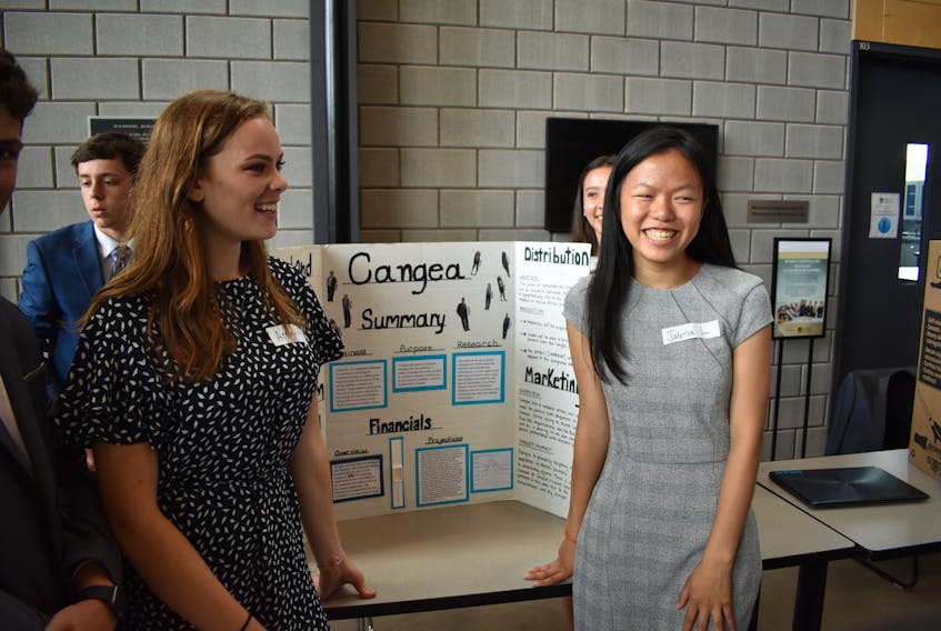Amy Mebesius, left, and Jalena Lee talk about their 2018 SHAD project, a band which helps detect carbon monoxide in the lungs of someone who inhaled smoke.