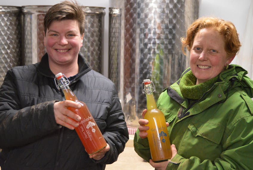 Verena Varga, left, and Amy Smith, co-owners of Heart Beet Organics farm in Darlington, are all smiles after the provincial minister of finance lifted a liquor inspector’s warning to a Charlottetown restaurant which was selling kombucha produced by the farm.