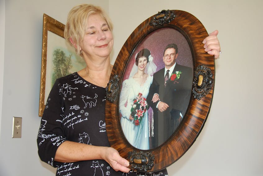 Orlanda Drebit of Appin Road, P.E.I. holds a wedding day photo of her and her late husband, Don. She is thrilled to have just tracked down her wedding and engagement rings, among others, after forgetting where she hid them in 2015.