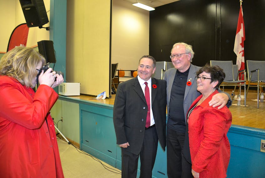 Charlottetown city councillor Bob Doiron, left, poses for a photo with Premier Wade MacLauchlan and Doiron's fellow Liberal nominee Marcia Carroll, right, on Monday night. Doiron was selected as the candidate for the impending District 11, Charlottetown-Parkdale byelection to replace former Education minister Doug Currie. Taking the photo is cabinet liaison Nancy MacPhee. (Teresa Wright/The Guardian)