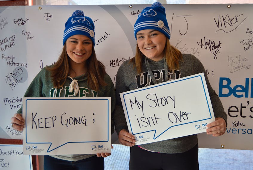 UPEI students Adeline Small, left, and Tessa Rogers spread awareness about mental illness by taking part in the annual Bell Let’s Talk campaign Jan. 31.