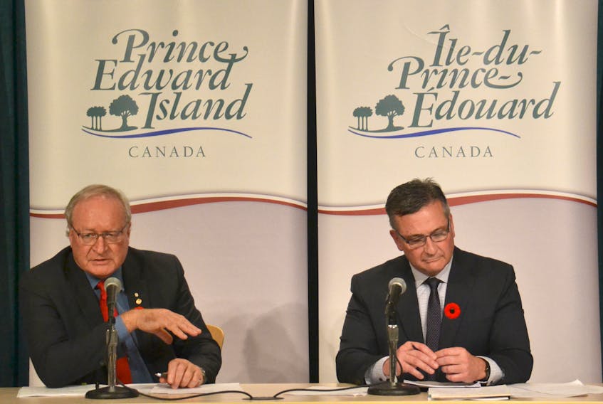 Premier Wade MacLauchlan and Finance Minister Heath MacDonald are shown at a news conference in Charlottetown on Wednesday where they announced that the province saw a $75.2 million surplus in 2017-2018. MacLauchlan says the surplus will go toward paying down the province’s debt