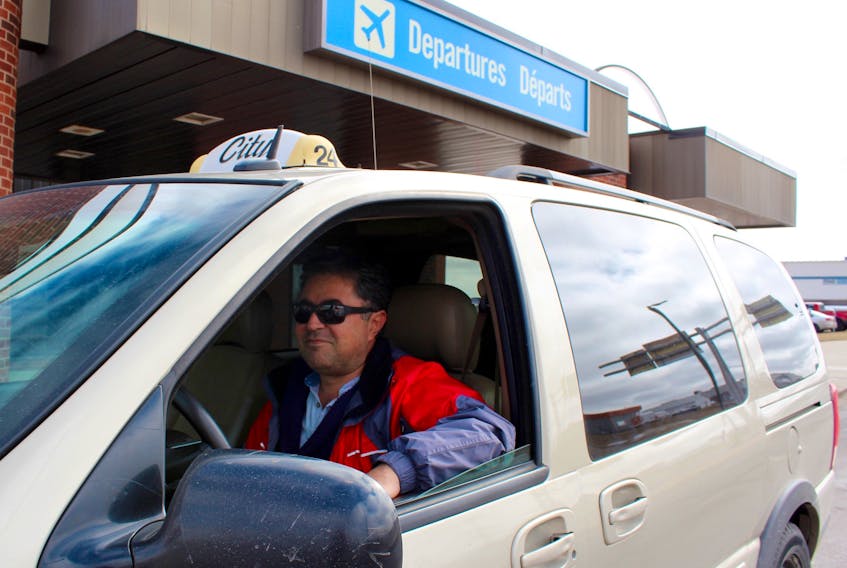 Ali Dehbozorgi, a City Taxi driver, drops off a customer at the Charlottetown Airport Tuesday. The airport is opening up its taxi contract to allow more than one company to park at the arrivals gate. Grace Gormley/