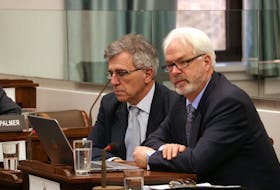 Communities Land and Environment Minister Richard Brown, left, and George Somers, manager of drinking water and wastewater management, take questions before a legislative standing committee in Charlottetown on Tuesday. Proposed regulations for the provinces Water Act were released on Tuesday.