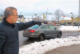 Charlottetown Mayor Philip Brown points to the intersections by Vogue Optical that connect St. Peter’s Road, Brackley Point Road and Belvedere Avenue. Brown said he would like to see some action this year on a proposed roundabout for the area.