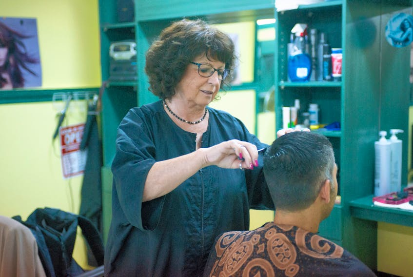 Rose Savard, seen in this 2015 image cutting hair at Kuts and Kurls in Charlottetown, says she “enjoyed every minute” in her long career as a barber.