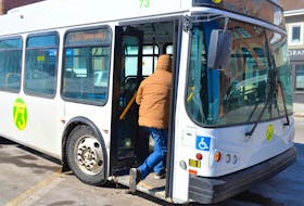 A passenger climbs aboard the bus on Grafton Street in Charlottetown on Friday. T3 Transit’s funding partners are prepared to spend up to $500,000 to purchase three pre-owned buses that will help get the fleet through the next two years until new buses can be acquired.