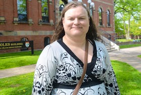 Pride P.E.I. advocacy director Andrea MacPherson stands in front of the Coles Building in Charlottetown, where the group hopes legislation will be introduced at some point this year banning conversion therapy in the province.