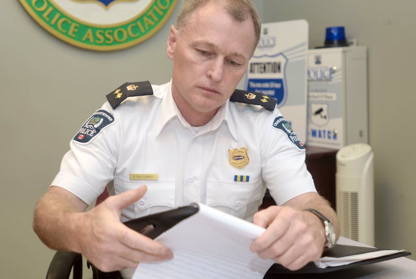 Deputy Police Chief Brad MacConnell makes some notes at the Charlottetown police station on Monday shortly after the department announced it had charged a 39-year-old city woman with two counts of infanticide. The charges, which followed more than a year of investigation, are related to incidents from 2014 and 2016.