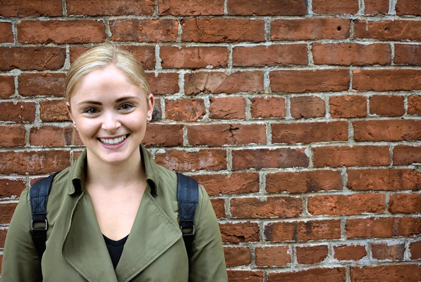 Lacey Koughan smiles outside Kettle Black in downtown Charlottetown as she speaks about the female empowerment organization she founded, 24 Strong.
