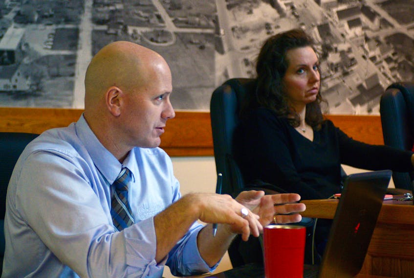 Montague Coun. Daphne Griffin, right, listens as CAO Andy Daggett discusses a request for a decision during the town’s committee of council meeting Monday night. The request was for the town to re-allocate about $251,000 in gas tax funding to install a solar power field at Cavendish Farms Wellness Centre and construct a sidewalk on Fraser Street. MITCH MACDONALD/THE GUARDIAN