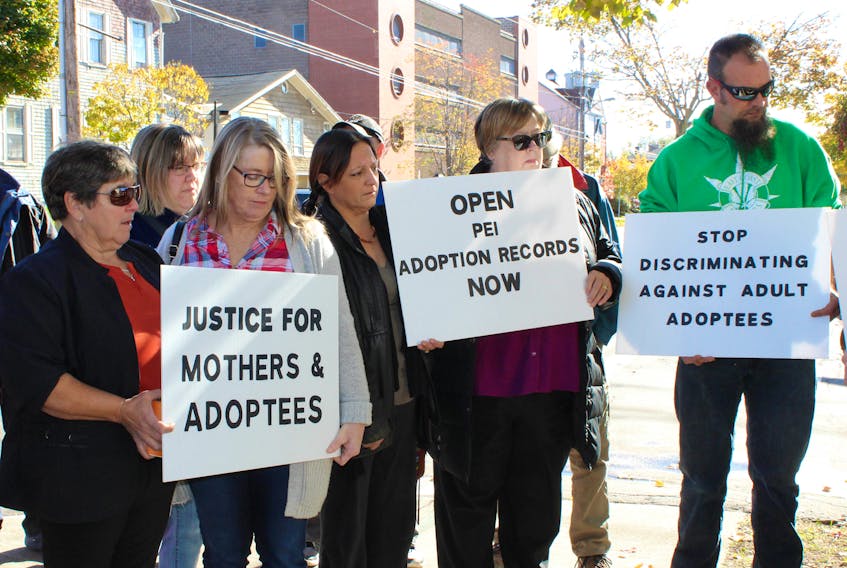 A small crowd gathered with signs in support of opening P.E.I.’s adoption records during the Truth and Transparency for P.E.I. Mothers, Fathers, and Adoptees event on Sunday in front of the Catholic Family Services building in Charlottetown. The building, formerly known as St. Gerard’s Home for Unwed Mothers, was significant to the event. It was once the home where many of the mothers who spoke during Sunday’s rally stayed while they were pregnant many years ago.