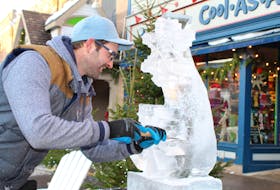 Ian Drummond carefully crafts a snowflake design from a one-metre block of ice on Saturday during the downtown Charlottetown market as part of the Victorian Christmas Weekend. Drummond’s creations were a highlight for many who took in the market.