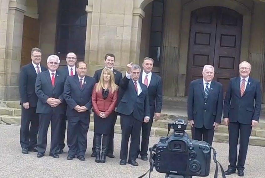In this screenshot of a video posted to YouTube by P.E.I. photographer John Morris, Liberal MLA Richard Brown is shown giving the middle finger to a member of the public during a 2016 photoshoot for a government Christmas card.