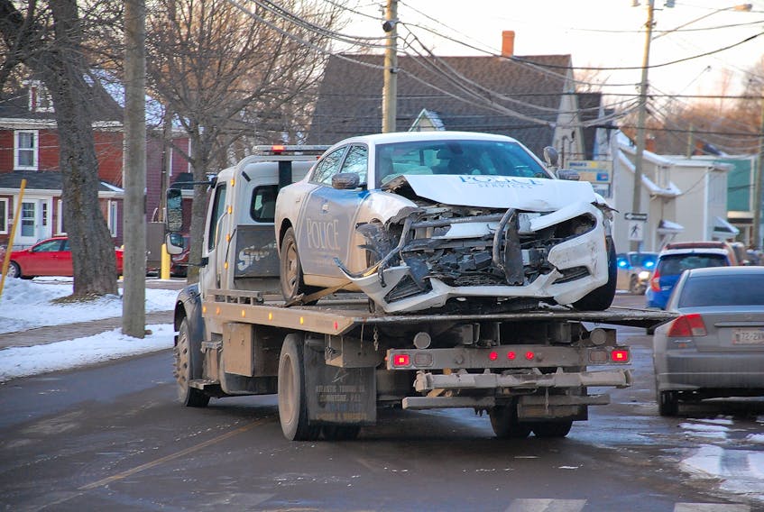 A Charlottetown Police cruiser is towed away following a two-vehicle collision at the corner of Passmore Street and Queen Street on Dec. 11. The officer was taken to hospital with minor injuries for precautionary reasons.