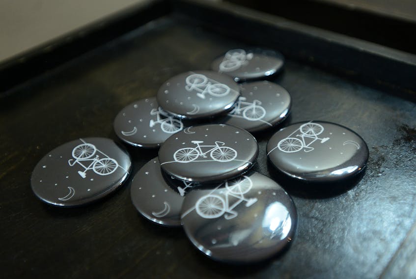 Friends of Josh Underhay printed buttons in memory of him at a community gathering on Saturday. Underhay was a father, a teacher, an outspoken cycling advocate and a Green party candidate in Charlottetown-Hillsborough.