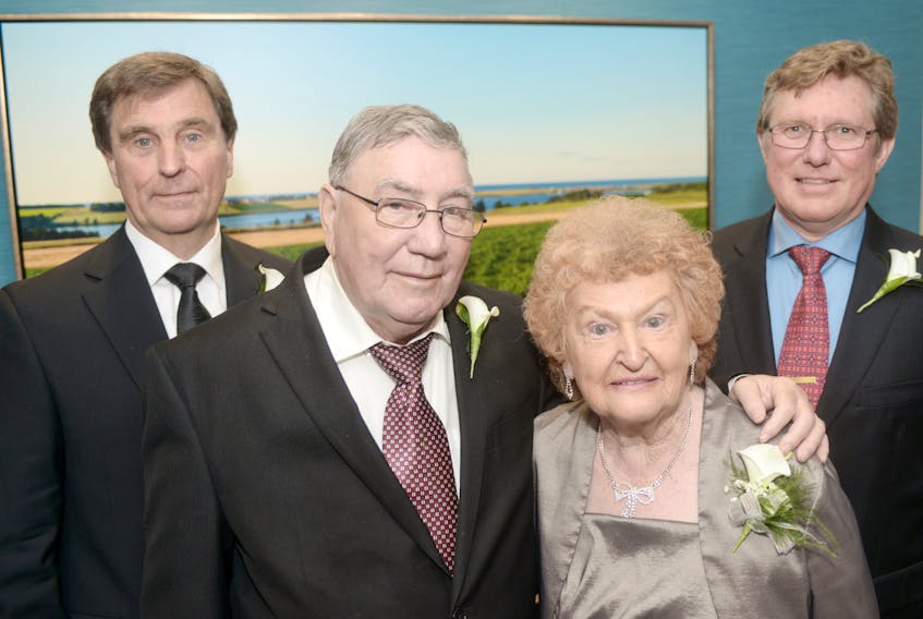 Mike Cassidy, from left, Angus and Rita MacCormack, and Jason Aspin meet prior to being inducted in the Junior Achievement P.E.I. Business Hall of Fame during Wednesday's gala dinner at the P.E.I. Convention Centre.