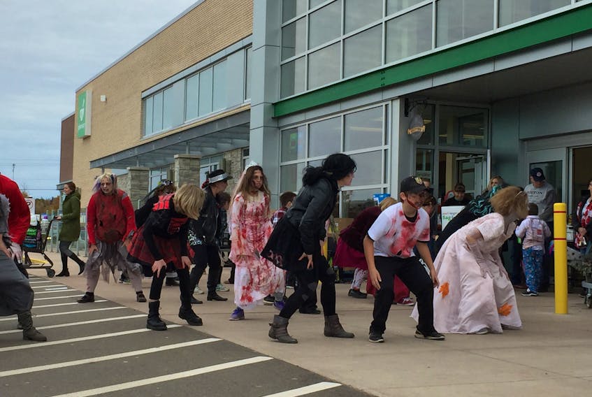 The undead dance their way into the Sobeys grocery store in Stratford on Saturday