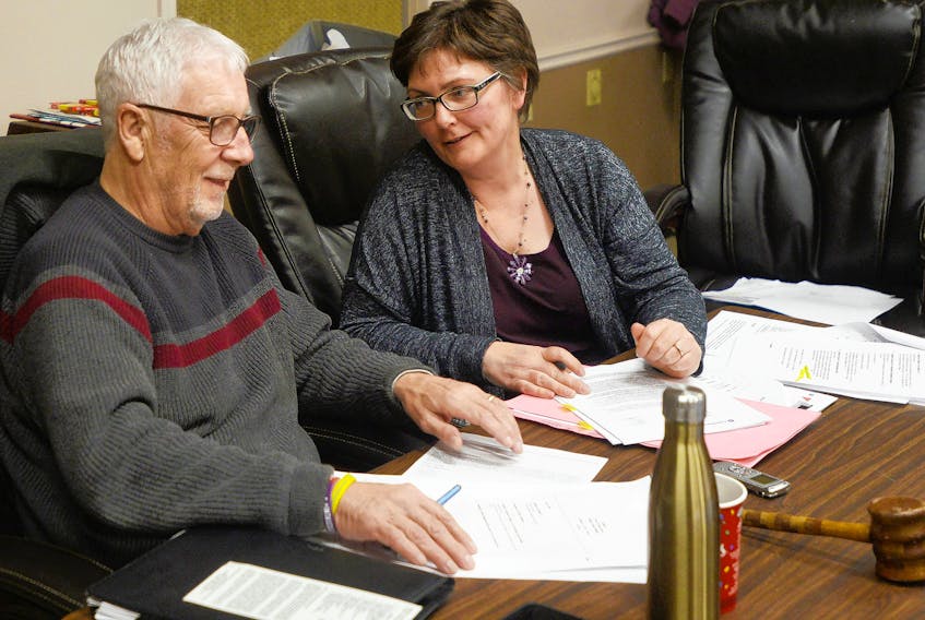 Three Rivers CAO Jill Walsh, right, looks over some documents with Mayor Ed MacAulay following a meeting in February.